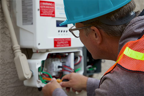 Man wiring electric meter